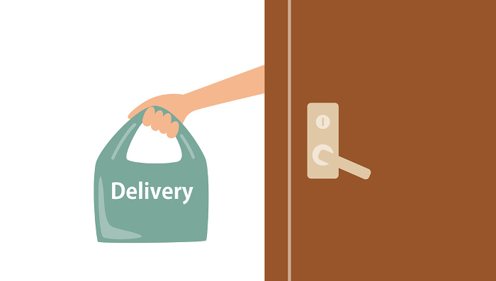 Illustration of a hand holding a delivery bag out of an open door