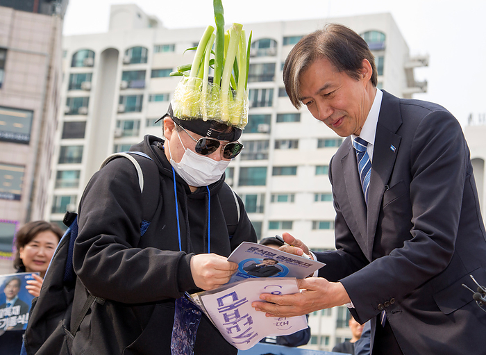 2024 South Korea General Election: The Rebuilding Korea Party Cho Kuk, April 6, 2024 : Cho Kuk  R , leader of the Rebuilding Korea Party  aka the Korea Innovation Party  for proportional representation seats, greets a supporter wearing a cap covered with green onions at the party s meeting with supporters in Seoul, South Korea, ahead of the April 10 general elections. The green onions makes a parody of South Korean President Yoon Suk Yeol who aroused anger by finding the price tag of 875 won   0.65  for a bunch of green onions a  reasonable price  at a grocery mall last month. The 875 won   0.65  was a temporary discount price offered due to a government subsidy and the average retail prices of green onions was about 3,000 to 4,000 won   2.2 to 2.9  for weeks, which was some of the highest levels over the years. Cho Kuk, South Korea s former Justice Minister under the previous liberal Moon Jae In administration, was an architect of the liberal government s prosecution reform.  Photo by Lee Jae Won AFLO 