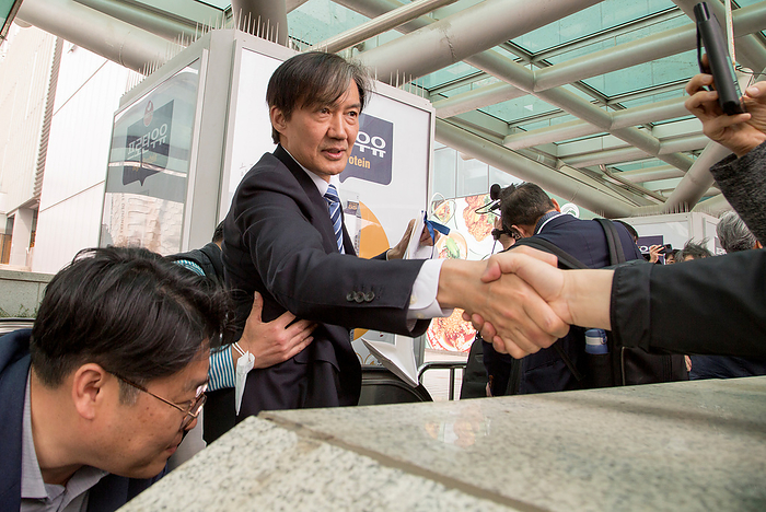 2024 South Korea General Election: The Rebuilding Korea Party Cho Kuk, April 6, 2024 : Moving on an escalator to take a train at a station, Cho Kuk  C , leader of the Rebuilding Korea Party  aka the Korea Innovation Party  for proportional representation seats, shakes hands with a supporter after the party s meeting with supporters in Seoul, South Korea, ahead of the April 10 general elections. Cho Kuk, South Korea s former Justice Minister under the previous liberal Moon Jae In administration, was an architect of the liberal government s prosecution reform.  Photo by Lee Jae Won AFLO 
