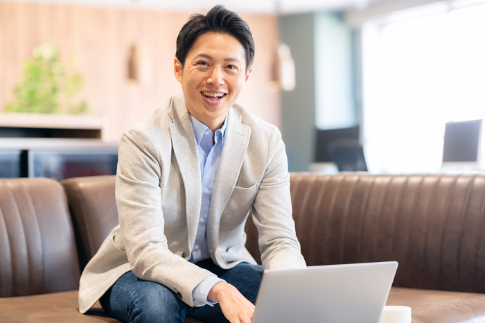 Middle Japanese man working in office (People)