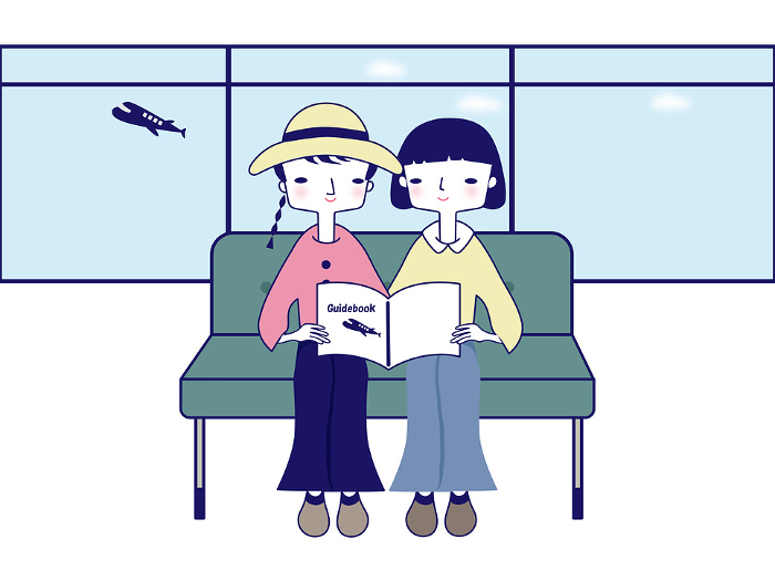 Girls traveling, girls looking at guidebooks at the airport.