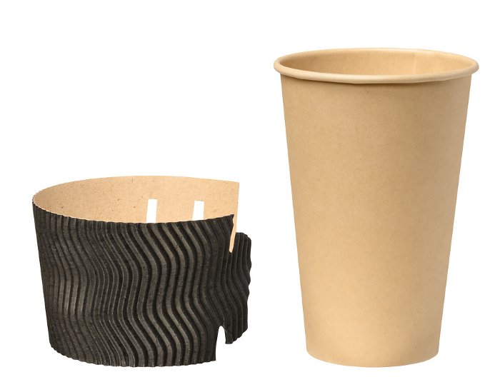 Empty brown cup for tea and coffee on a white isolated background, corrugated stand Empty brown cup for tea and coffee on a white isolated background, corrugated stand