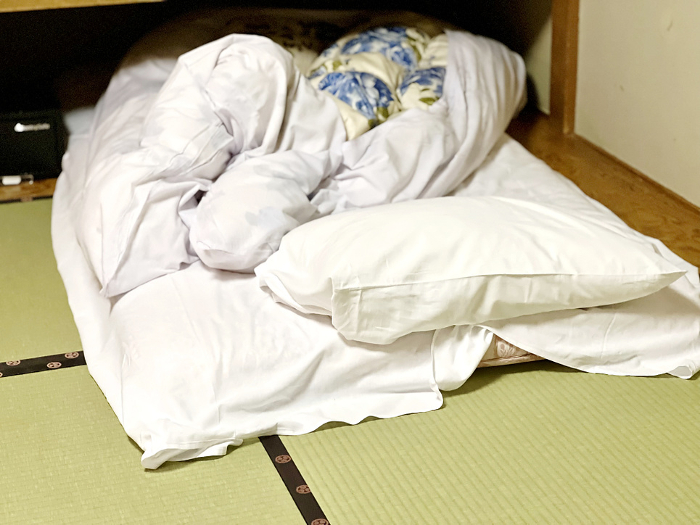 Disheveled futon in ryokan room