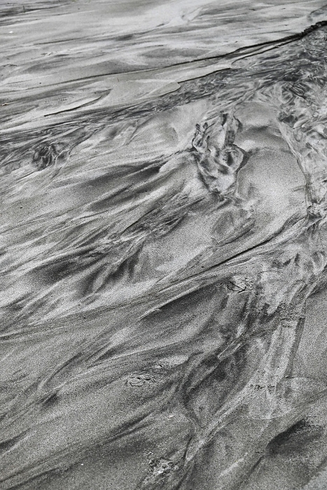 Abstract and artistic scene created by sand on the beach by chance, beauty of nature.