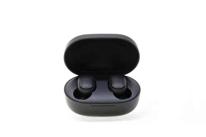 Wireless earphones charged in a charging case