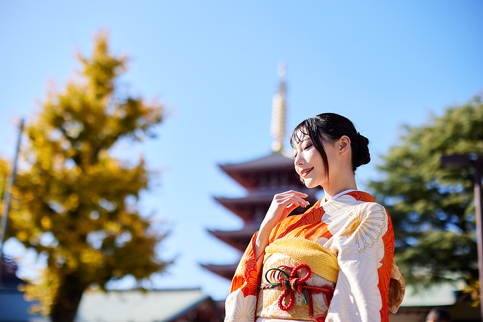 Japanese woman in furisode kimono with her eyes down