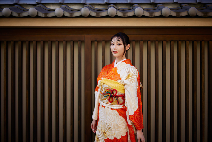Japanese woman in furisode kimono looking at the camera