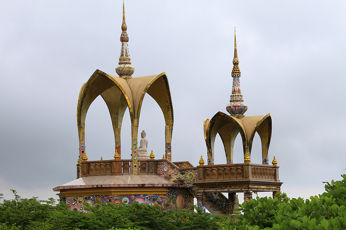 Long shot of two arched domes and a sitting Buddha, at Pha Sorn Kaew, in Khao Kor, Phetchabun, Thailand Long shot of two arched domes and a sitting Buddha, at Pha Sorn Kaew, in Khao Kor, Phetchabun, Thailand, by Zoonar RealityImages