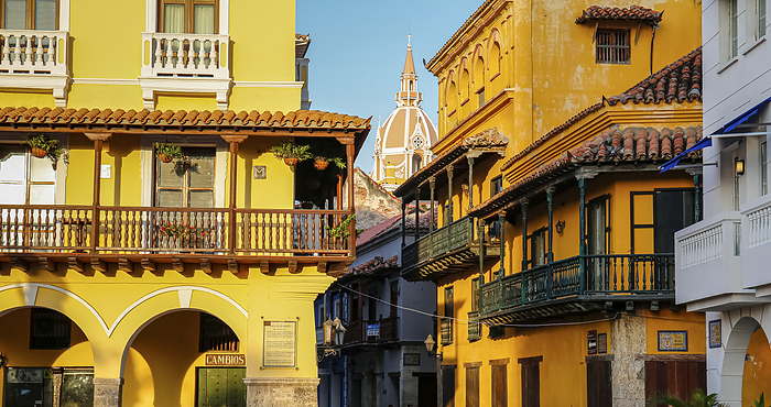 View to typical colorful buildings with church tower in the back, Cartagena, Unesco World Heritage View to typical colorful buildings with church tower in the back, Cartagena, Unesco World Heritage, by Zoonar Uwe Bergwitz