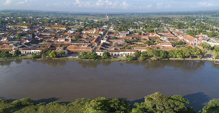 Aerial view of the historic town Santa Cruz de Mompox in sunlight from the riverside, World Heritage Aerial view of the historic town Santa Cruz de Mompox in sunlight from the riverside, World Heritage, by Zoonar Uwe Bergwitz