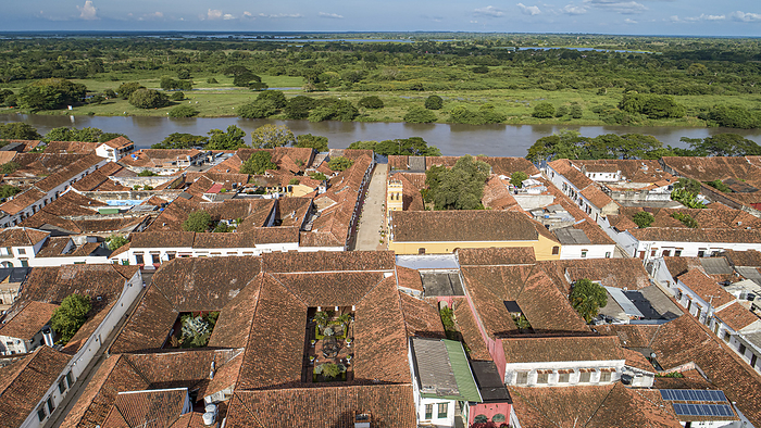 Aerial view of the historic town Santa Cruz de Mompox in sunlight with river and green sourrounding, Aerial view of the historic town Santa Cruz de Mompox in sunlight with river and green sourrounding, Nature, by Zoonar Uwe Bergwitz