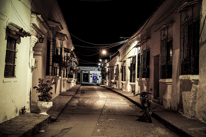 View to typical street with one story buildings at night in light of lanterns, Santa Cruz de Mompox, View to typical street with one story buildings at night in light of lanterns, Santa Cruz de Mompox, World Locations, by Zoonar Uwe Bergwitz