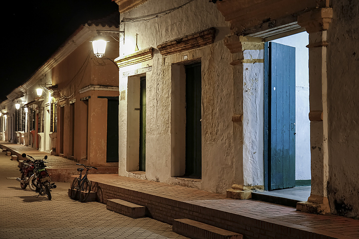 View to typical one story buildings at night in light of lanterns, Santa Cruz de Mompox, Colombia, W View to typical one story buildings at night in light of lanterns, Santa Cruz de Mompox, Colombia, W, by Zoonar Uwe Bergwitz