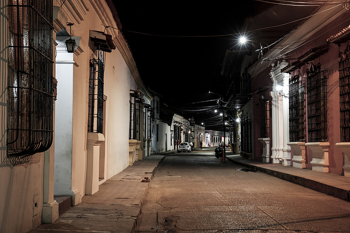 View to typical street with one story buildings at night in light of lanterns, Santa Cruz de Mompox, View to typical street with one story buildings at night in light of lanterns, Santa Cruz de Mompox, World Locations, by Zoonar Uwe Bergwitz