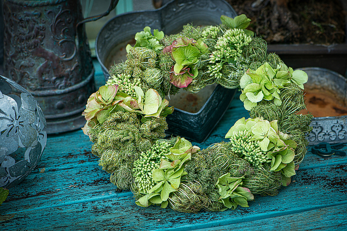 Flower wreath on wooden background Flower wreath on wooden background, by Zoonar Judith Kiener
