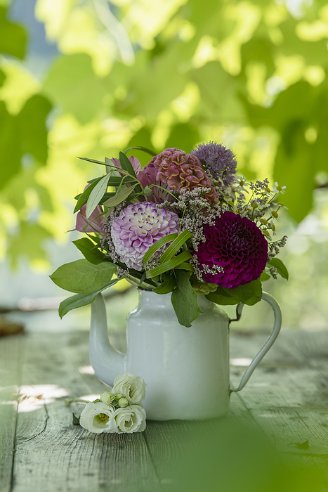 Romantic flower bouquet on a wooden table Romantic flower bouquet on a wooden table, by Zoonar Judith Kiener