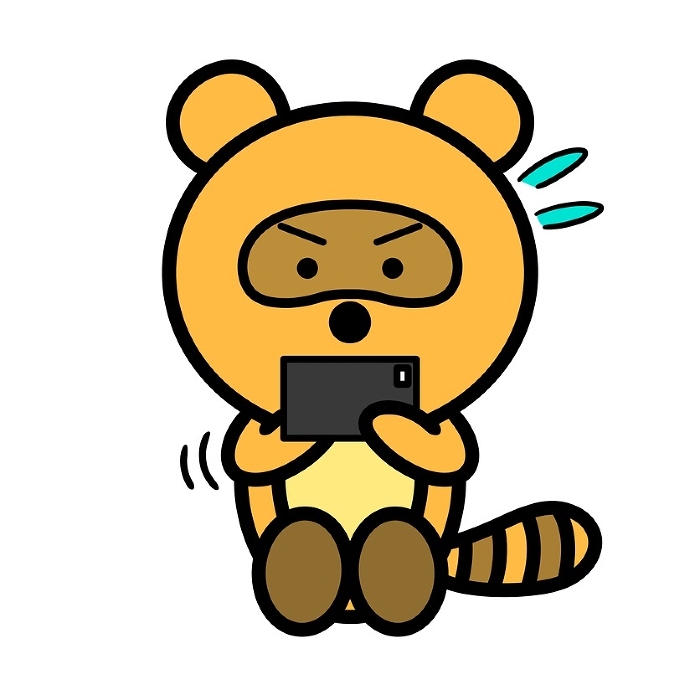 A raccoon dog absorbed in a smartphone game