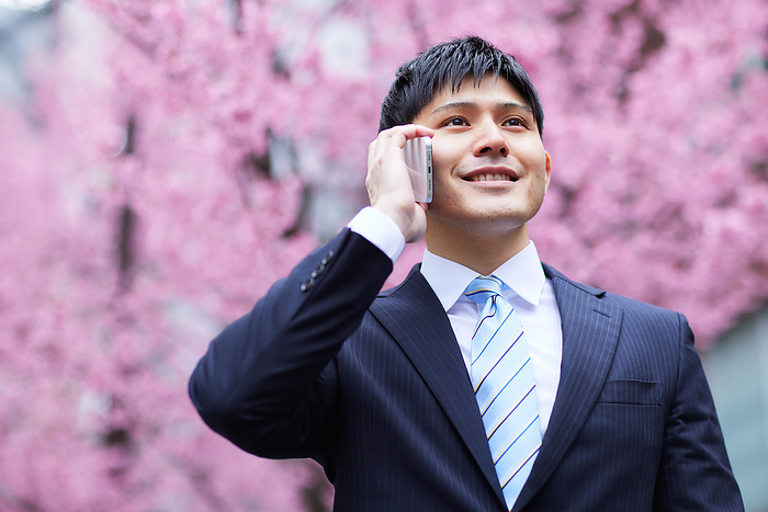 Japanese man talking on his cell phone