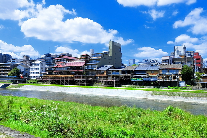 The Kamo River and the town along the Kamo River in Kyoto, Kyoto, Japan, with summer clouds spreading out. Shooting downstream between the Matsubara and Danguri bridges