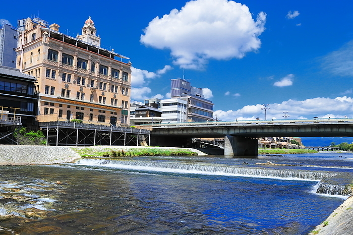 The Kamo River and the town along the Kamo River in Kyoto, Kyoto, Japan, with summer clouds spreading out. Shooting upstream between Danguri Bridge and Shijo Ohashi Bridge