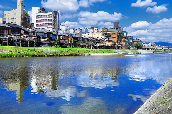 The Kamo River and the town along the Kamo River in Kyoto, Kyoto, Japan, with summer clouds spreading out. Shooting upstream between the Shijo and Sanjo Ohashi bridges