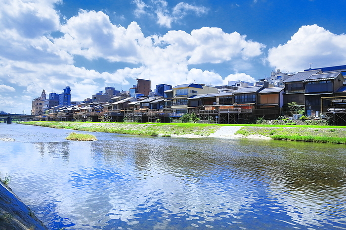 The Kamo River and the town along the Kamo River in Kyoto, Kyoto, Japan, with summer clouds spreading out. Shooting downstream between the Shijo and Sanjo Ohashi bridges
