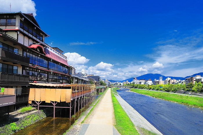 The Kamo River and the town along the Kamo River in Kyoto, Kyoto, Japan, with summer clouds spreading out. Shooting upstream from Matsubara Bridge