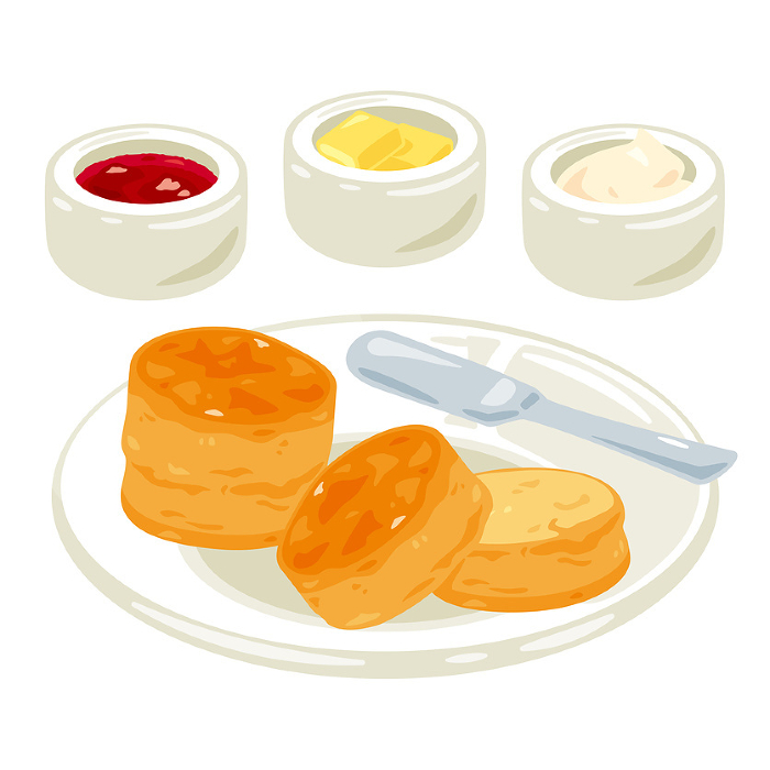 Scones and jam set on a plate