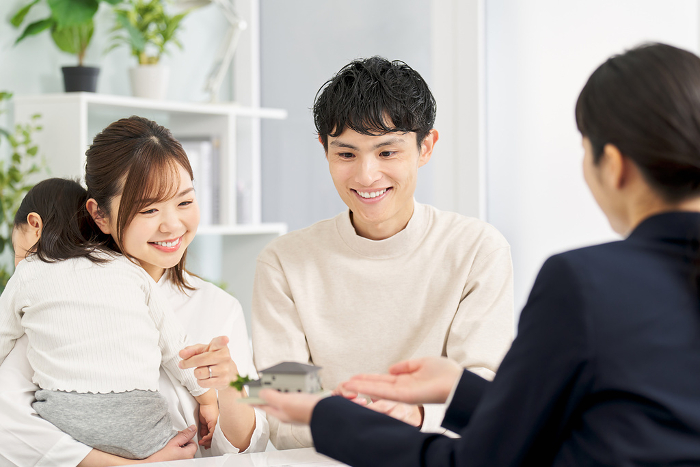 Japanese family being shown around real estate (People)