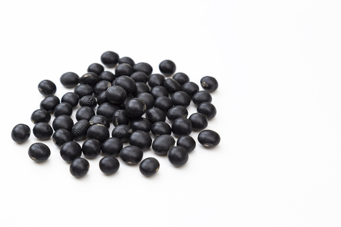 Black soybeans on white background