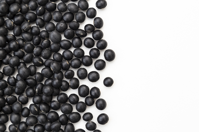 Black soybeans on white background