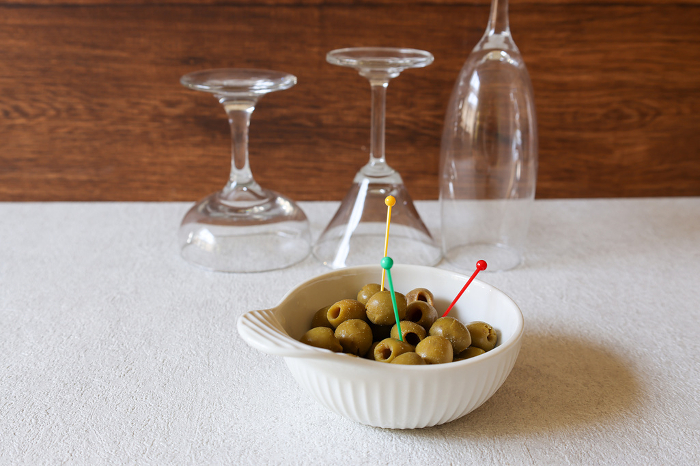 Olive oil pickles in a white ceramic bowl