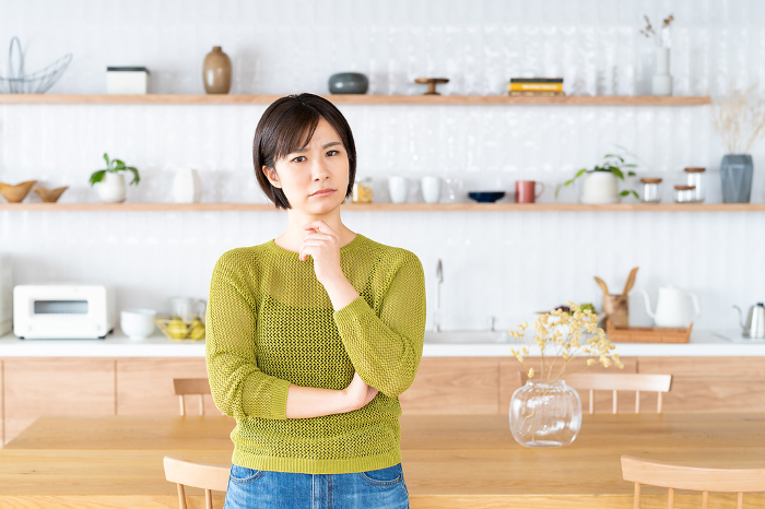 Young Japanese woman standing in the kitchen/dining room (People)