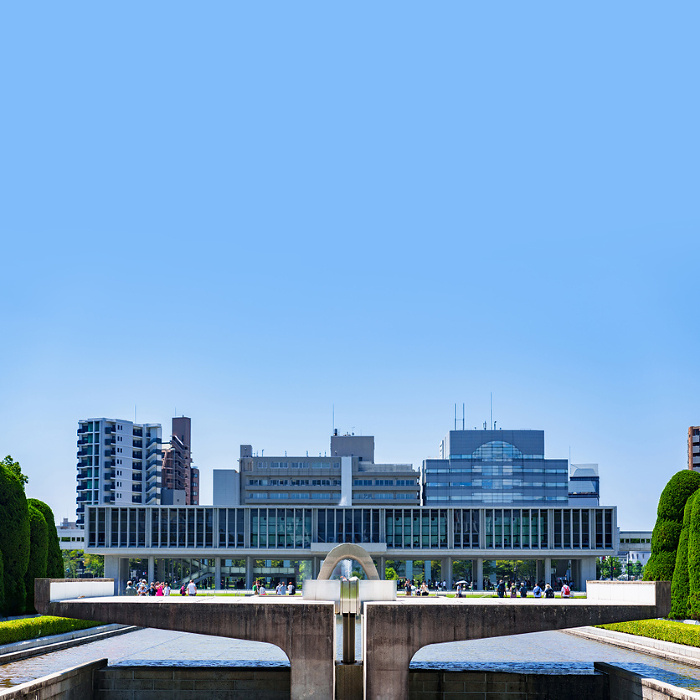 Cenotaph for the A-bomb Victims in Peace Park with Hiroshima Peace Memorial Museum in the background.