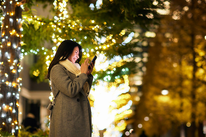 Japanese woman operating a smartphone