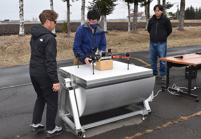 Drone station made of aluminum material. Officials explaining the situation where the drone lands on the table and unloads the cargo. Drone station made of aluminum material. Officials explain how the drone lands on the table and unloads the cargo, April 12, 2024, 1:16 p.m., in Kamishiboro cho, Japan  photo by Hitoshi Suzuki.