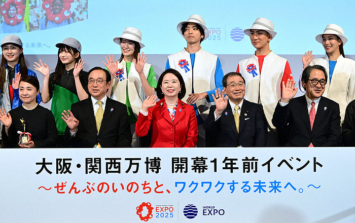 One year before the opening of Expo 2025 Osaka Kansai  From third to left in front  Eiko Jimi, Minister of State for Expo  70, Masakazu Tokura, Chairman of the Japan Association for the International Expositions, and others pose for a commemorative photo at an event held one year before the opening of Expo  70 in Osaka and Kansai.