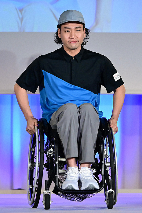 One year before the opening of Expo 2025 Osaka Kansai Influencer Yusuke Terada, wearing the uniform of a venue service attendant presented at an event one year before the opening of Expo  70 Osaka Kansai, proceeds down the runway in a wheelchair at 3:18 p.m. on April 13, 2024 in Minato ku, Tokyo.