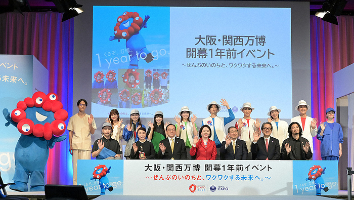 One year before the opening of Expo 2025 Osaka Kansai  From the fourth person on the left in the foreground  Eiko Jimi, Minister of State for Expo  70, Masakazu Tokura, Chairman of the Japan Association for the International Expositions, and others pose for a commemorative photo at an event held one year before the opening of Expo  70 in Osaka and Kansai.