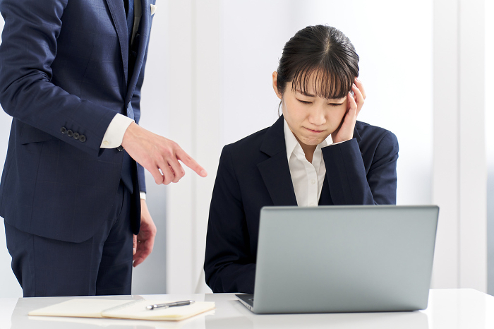 Japanese businesswoman blamed for work troubles.
