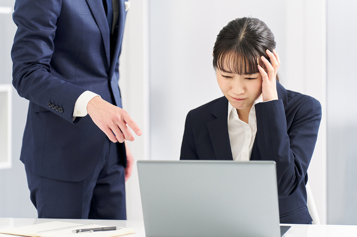 Japanese businesswoman blamed for work troubles.