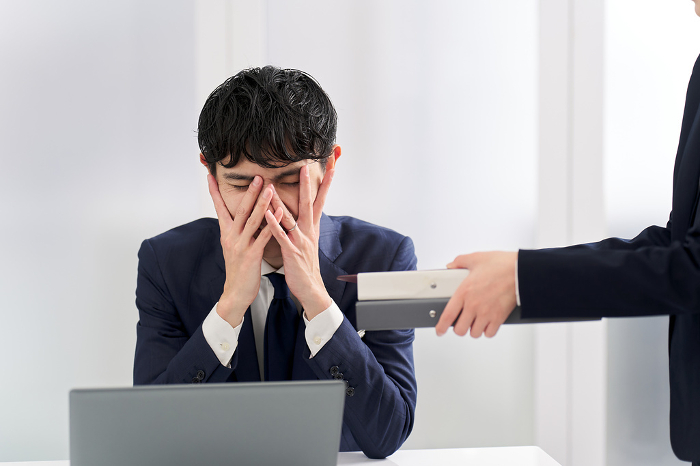 Japanese businessman blocked by workload (People)