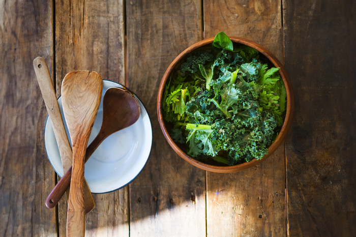 Kale salad in a wooden bowl