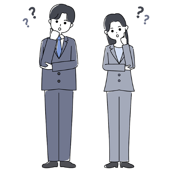 Man and woman in suits tilting their heads