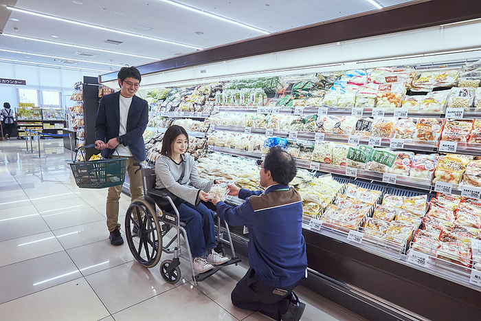 Photographed in 2024 Supermarket job   assisting a wheelchair user with shopping. March 2024 Chofu shi, Tokyo Whinageya Chofu Sengawa