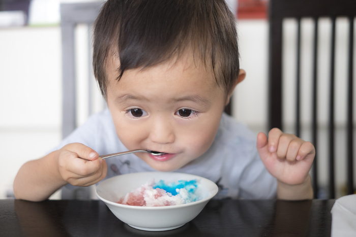 3-year-old boy eating shaved ice