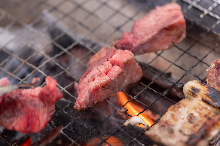Grilling meat on a barbecue