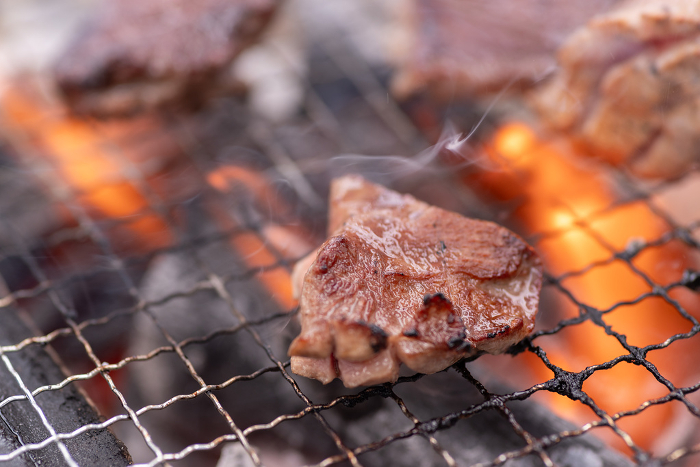 Grilling meat on a barbecue