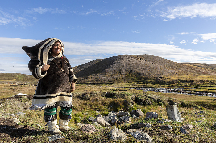 Inuit woman in traditional handmade clothing, Pond Inlet, Mittimatalik, in northern Baffin Island, Nunavut, Canada. Inuit woman in traditional handmade clothing, Pond Inlet, Mittimatalik, in northern Baffin Island, Nunavut, Canada, North America