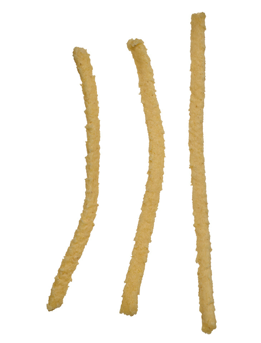 Raw wheat noodles on isolated background, top view. Spaetzle pasta Raw wheat noodles on isolated background, top view. Spaetzle pasta